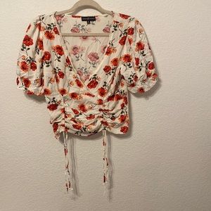 Cute blouse. Brand new top. Cute flowers all over.
